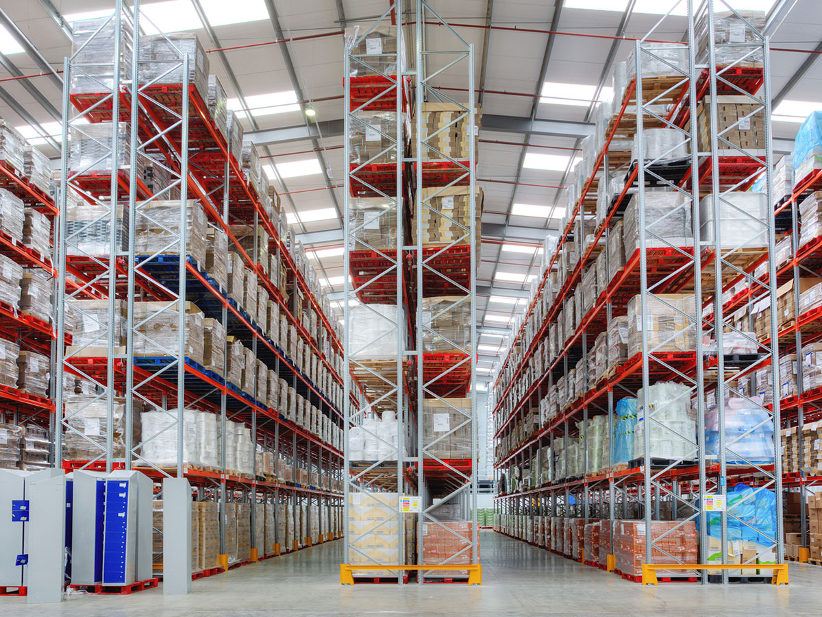 Double entry back to back aisle pallet racking storage solution for warehouse. Column guards and end barriers for impact protection, 2 ton UDL beams