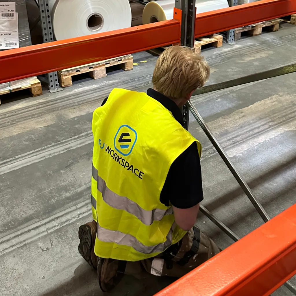 RJ Workspace Contractor carrying out a needed repair outlined in an inspection report on some pallet racking in Telford