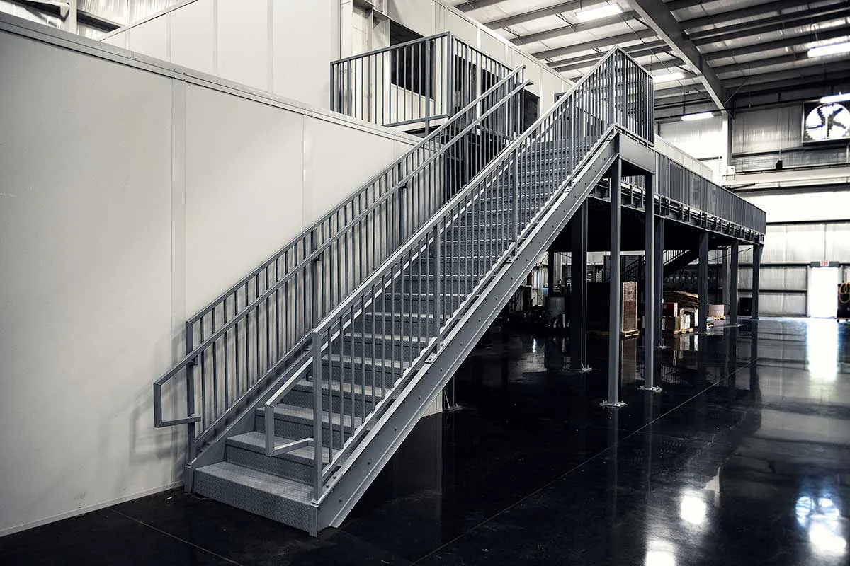 Galvanised Steel staircase, leading onto a mezzanine floor with office partitioning